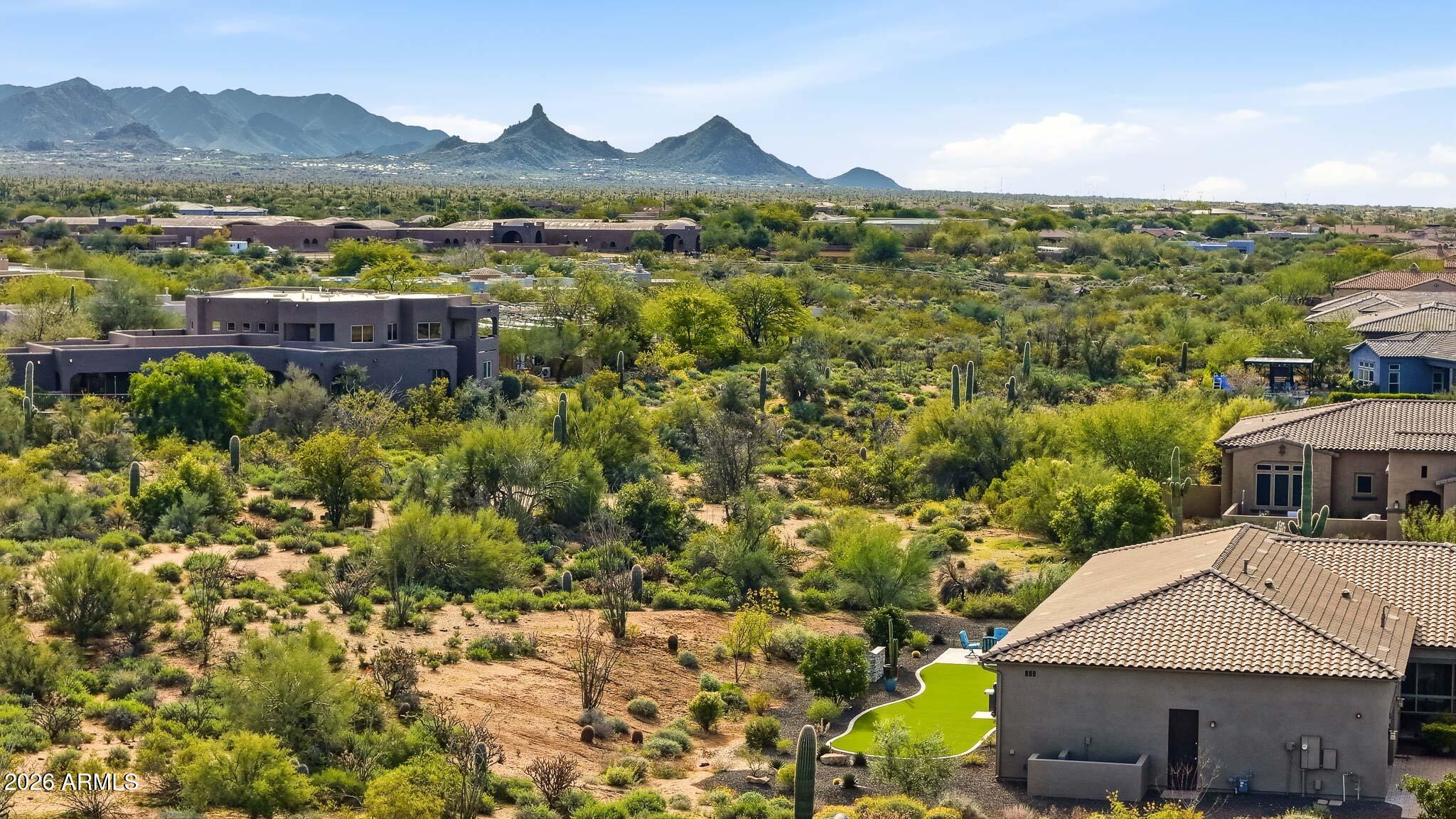 8597 East Arroyo Seco Road Scottsdale, AZ 85266 - Photo 65 of 73 a view of house with yard and mountain view in back
