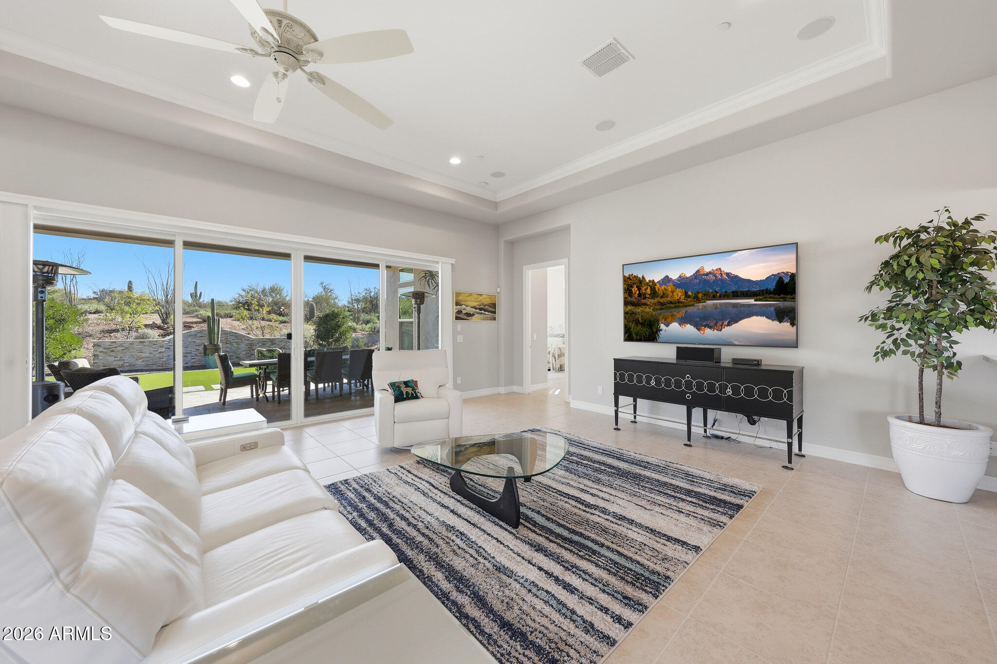 8597 East Arroyo Seco Road Scottsdale, AZ 85266 - Photo 8 of 73 a living room with furniture large window and flat screen tv