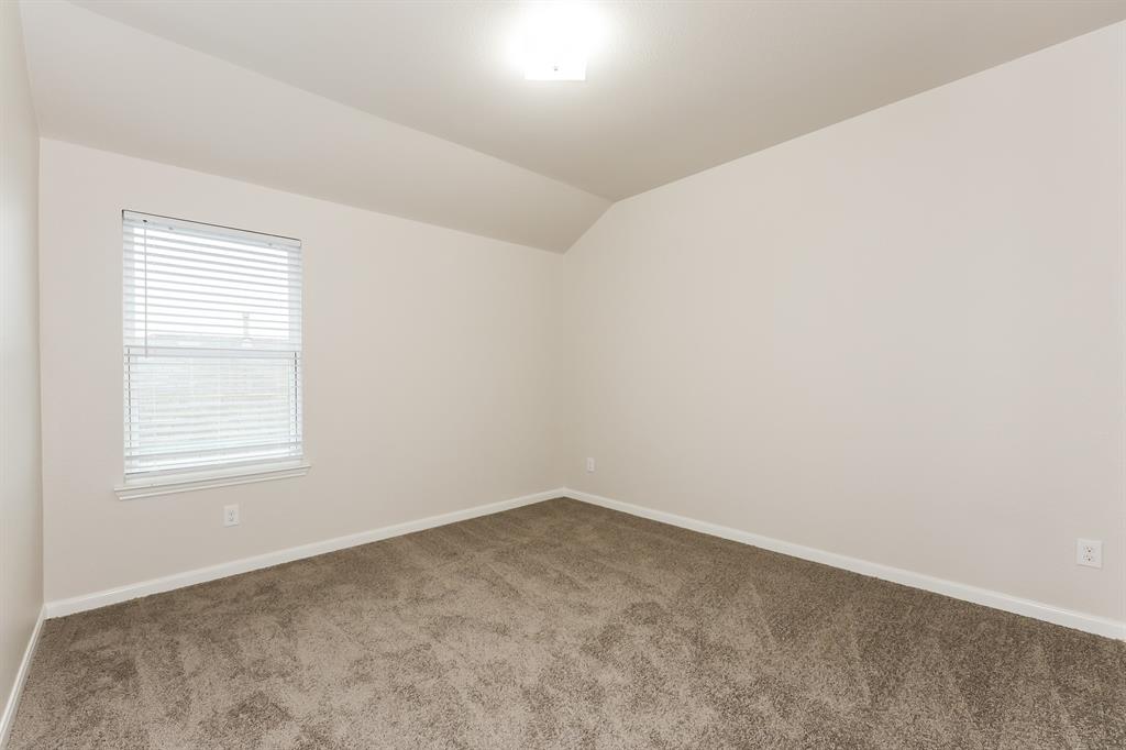 9430 Smoke Tree Drive Forney, TX 75126 - Photo 13 of 17 an empty room with a window