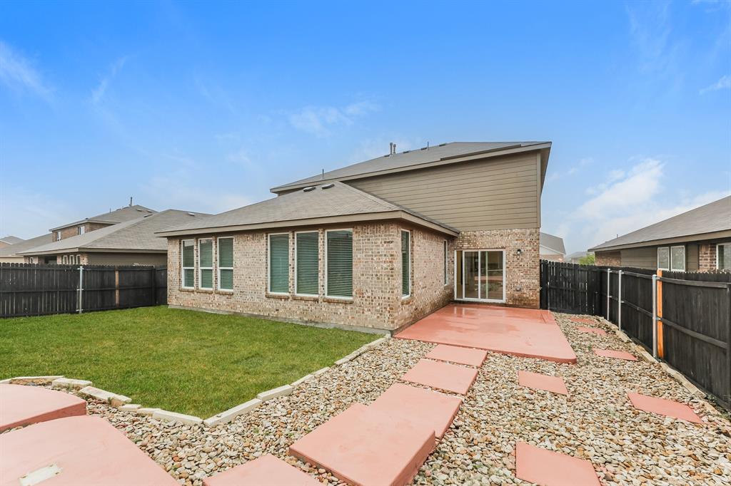9430 Smoke Tree Drive Forney, TX 75126 - Photo 16 of 17 a front view of a house with a yard
