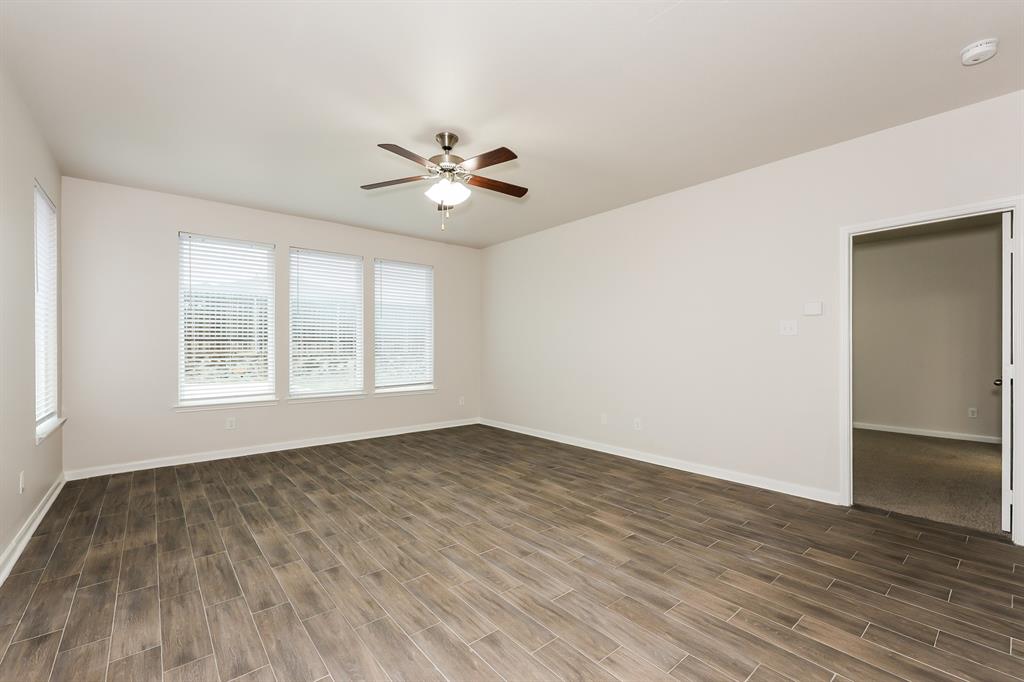 9430 Smoke Tree Drive Forney, TX 75126 - Photo 2 of 17 wooden floor in an empty room with a window