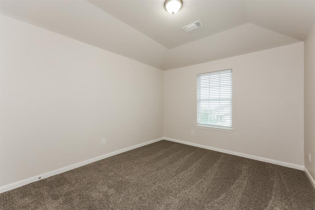 9430 Smoke Tree Drive Forney, TX 75126 - Photo 10 of 17 an empty room with a window