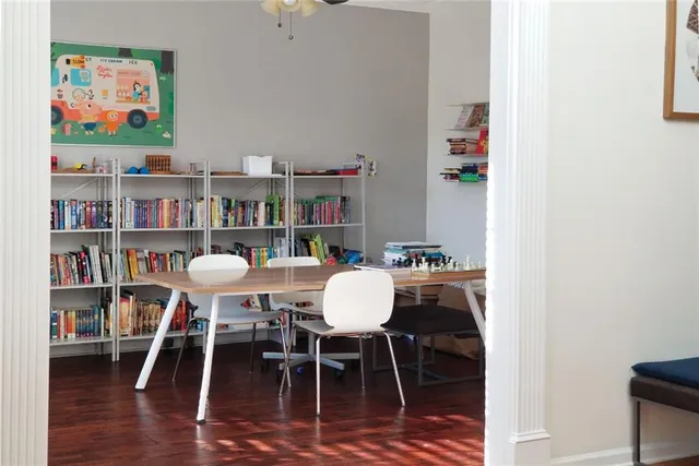 a living room with fireplace furniture and a flat screen tv
