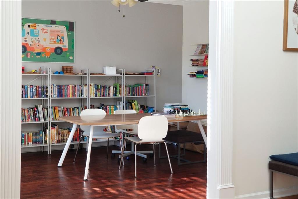 1799 Mapmaker Drive Northeast Dacula, GA 30019 - Photo 11 of 69 a dining room with furniture and wooden floor