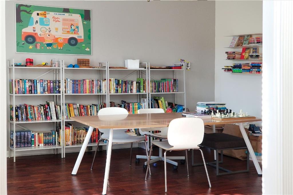 1799 Mapmaker Drive Northeast Dacula, GA 30019 - Photo 12 of 69 a view of a workspace with furniture and wooden floor