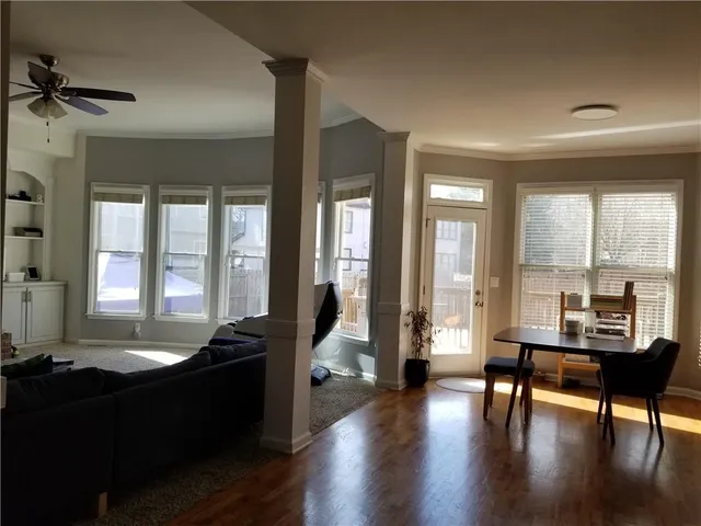 a kitchen with kitchen island granite countertop a sink appliances and cabinets