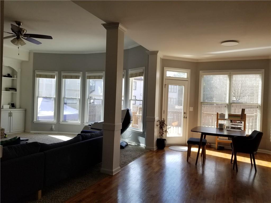1799 Mapmaker Drive Northeast Dacula, GA 30019 - Photo 17 of 69 a living room with furniture and wooden floor