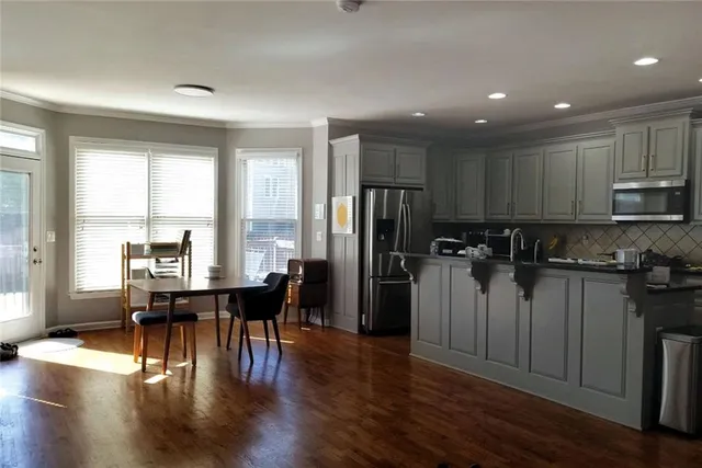 a bathroom with a sink a mirror and a toilet