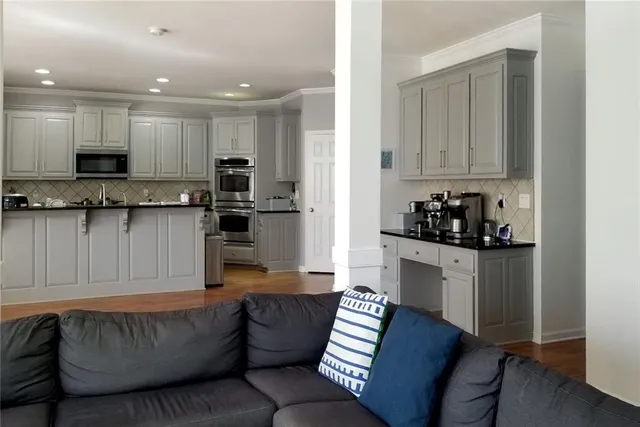 a view of entryway with stairs and wooden floor