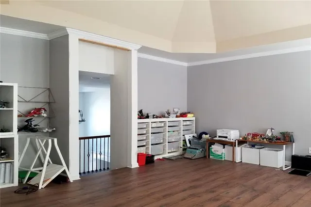 a bedroom with a bed and a table in it