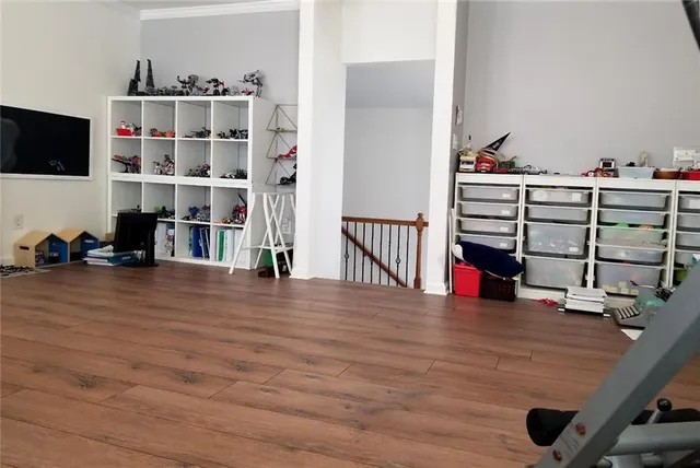 a bed room with a bed window and a chair