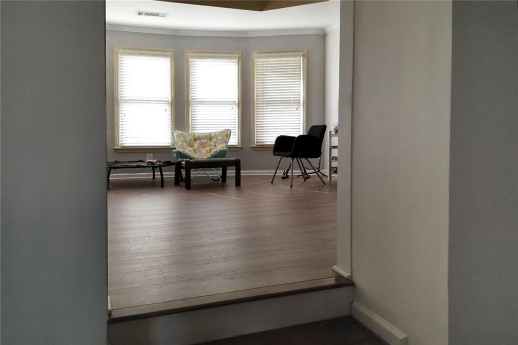 1799 Mapmaker Drive Northeast Dacula, GA 30019 - Photo 32 of 69 a view of dining room and kitchen with a window