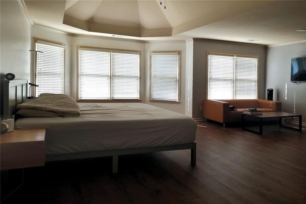1799 Mapmaker Drive Northeast Dacula, GA 30019 - Photo 35 of 69 a bedroom with a bed table and window