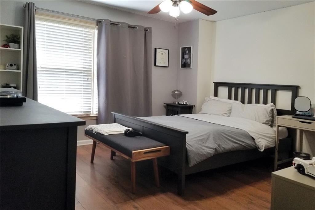 1799 Mapmaker Drive Northeast Dacula, GA 30019 - Photo 37 of 69 a bedroom with a bed and a table in it