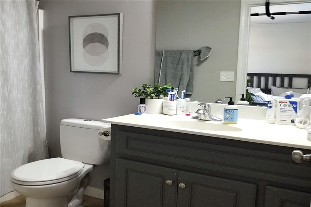 1799 Mapmaker Drive Northeast Dacula, GA 30019 - Photo 39 of 69 a bathroom with a sink and a toilet