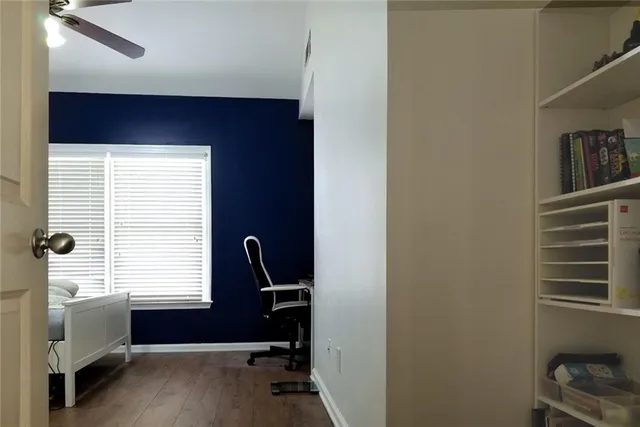 a room with furniture pool table and wooden floor