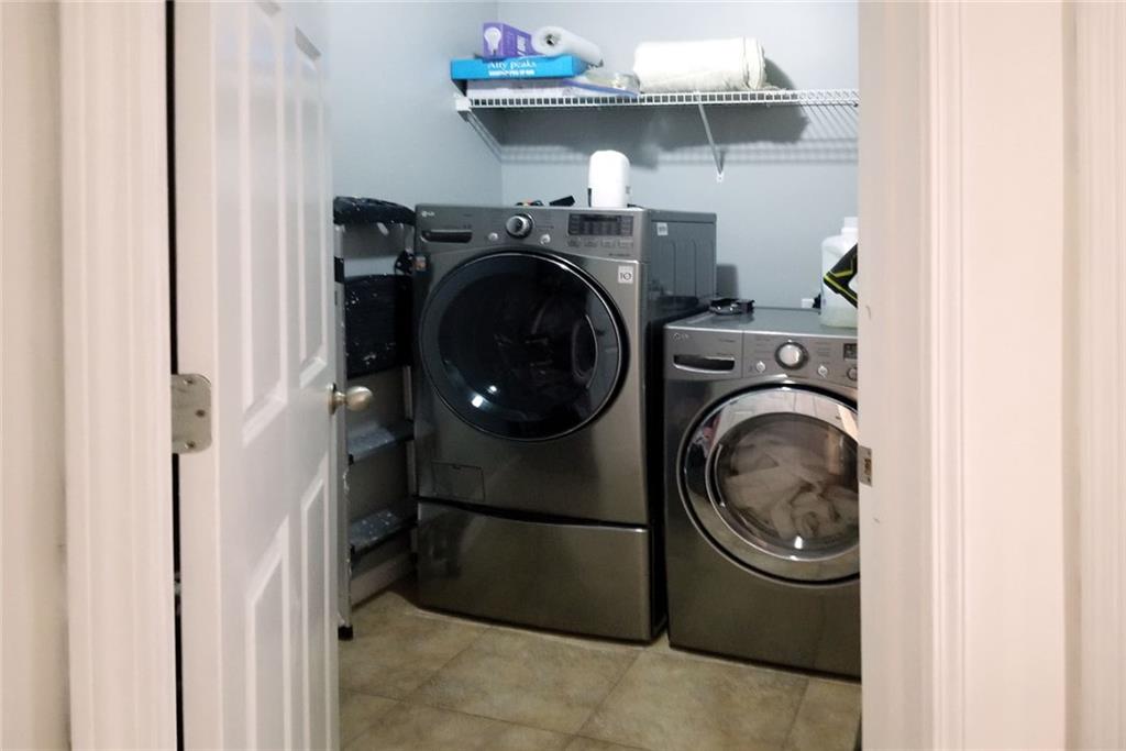 1799 Mapmaker Drive Northeast Dacula, GA 30019 - Photo 44 of 69 a utility room with dryer and washer