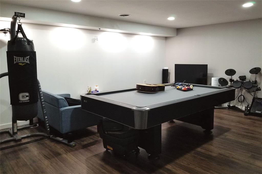 1799 Mapmaker Drive Northeast Dacula, GA 30019 - Photo 49 of 69 a dining room with furniture and wooden floor
