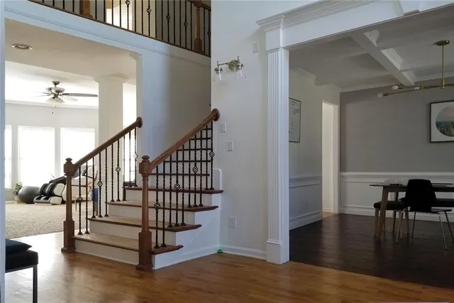 a view of a dining room with furniture and wooden floor