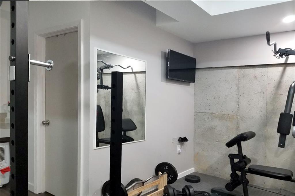 1799 Mapmaker Drive Northeast Dacula, GA 30019 - Photo 62 of 69 a bathroom with a sink and a mirror