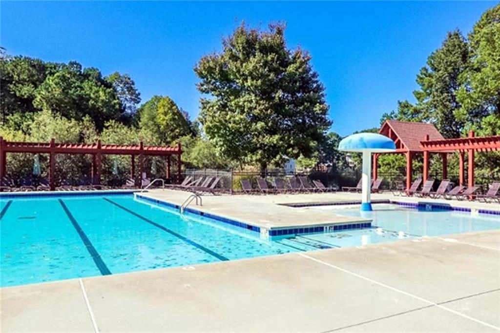 1799 Mapmaker Drive Northeast Dacula, GA 30019 - Photo 67 of 69 a view of a swimming pool with lounge chair