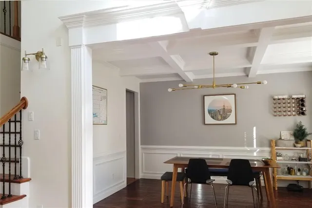 a dining room with furniture and wooden floor