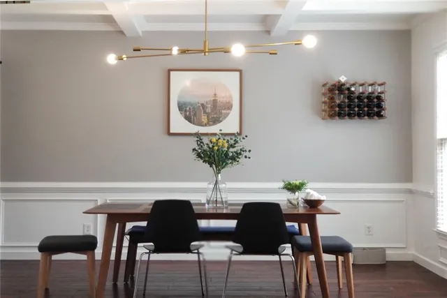 a view of a workspace with furniture and wooden floor