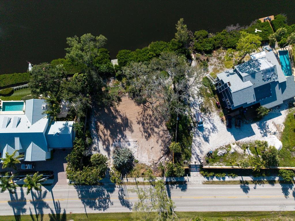 7676 Midnight Pass Road Sarasota, FL 34242 - Photo 20 of 20 an aerial view of houses with yard