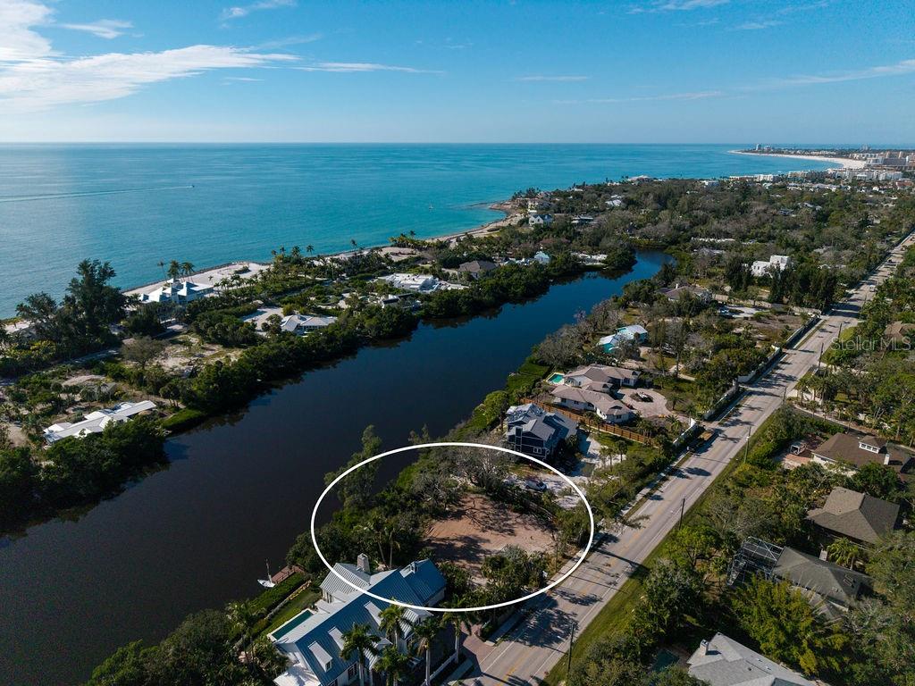 7676 Midnight Pass Road Sarasota, FL 34242 - Photo 3 of 20 an aerial view of ocean residential house with outdoor space