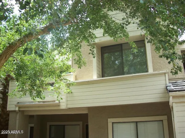 a view of a house with a tree