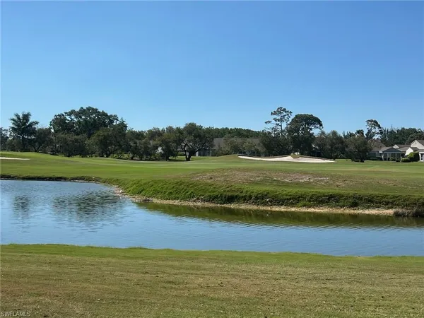 a view of a lake with a big yard