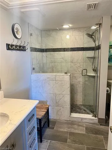 a bathroom with a sink and a shower