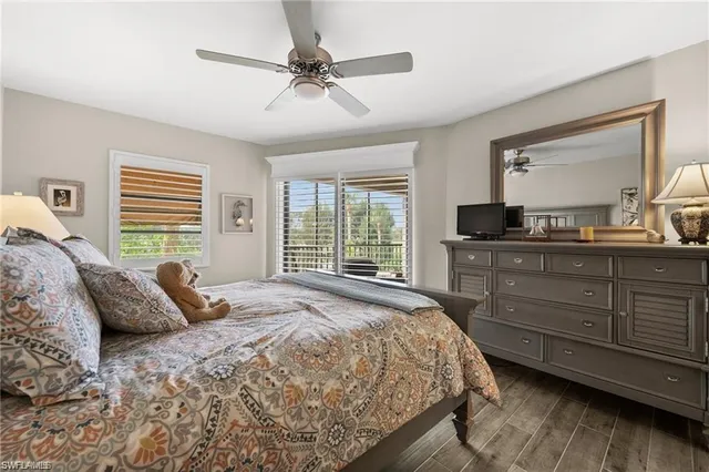 a bedroom with a large bed and a large window