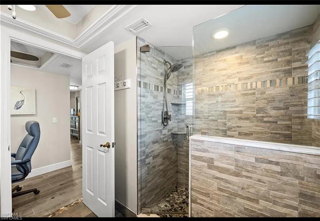 1790 Imperial Golf Course Boulevard, Unit A205 Naples, FL 34110 - Photo 10 of 28 a bathroom with a shower