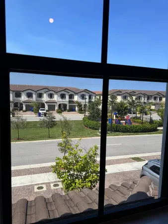 a view of swimming pool from a window