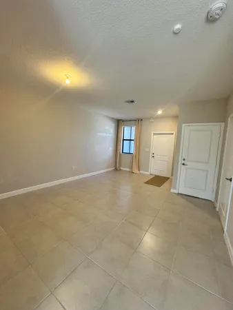 a view of an empty room with a window