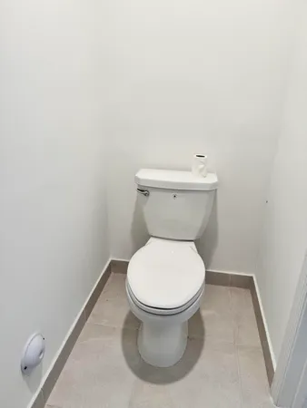 a bathroom with a toilet and a sink