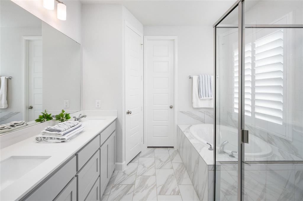 9600 Acorn Lane Little Elm, TX 75068 - Photo 15 of 34 a bathroom with a sink a toilet and shower