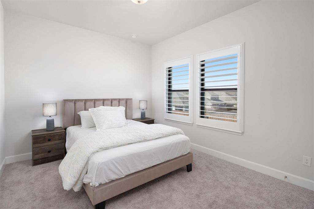 9600 Acorn Lane Little Elm, TX 75068 - Photo 20 of 34 a bedroom with a bed and a window