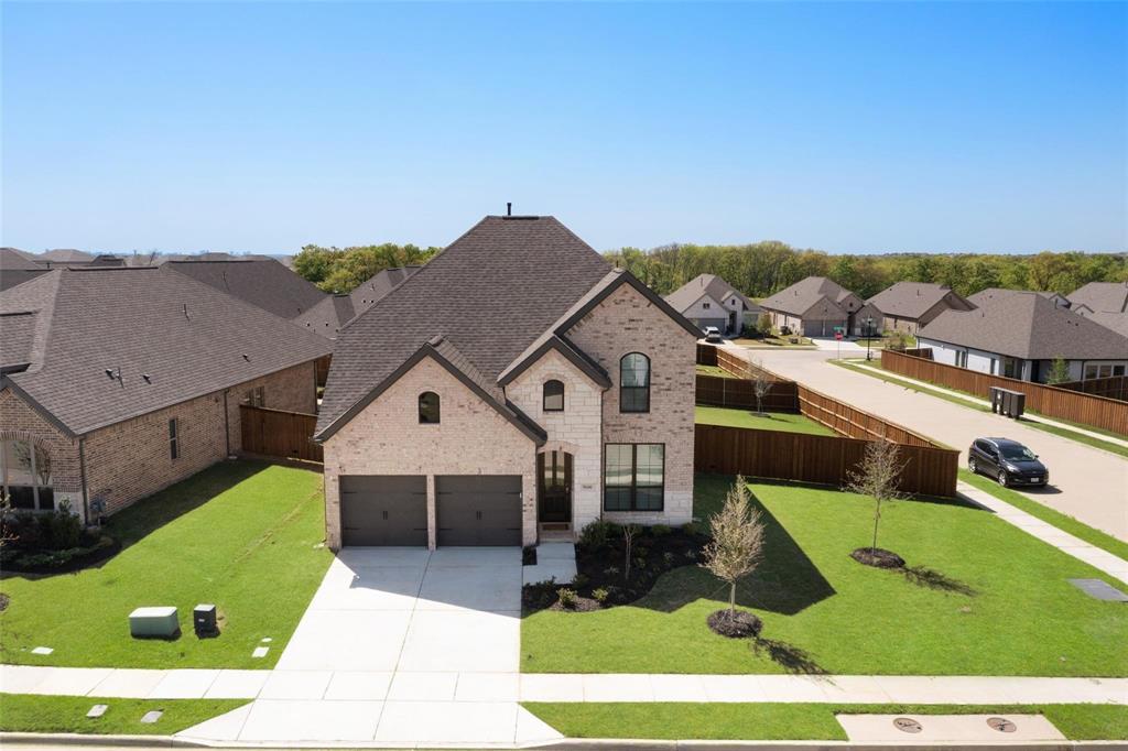 9600 Acorn Lane Little Elm, TX 75068 - Photo 2 of 34 a view of house with yard and mountain in the background