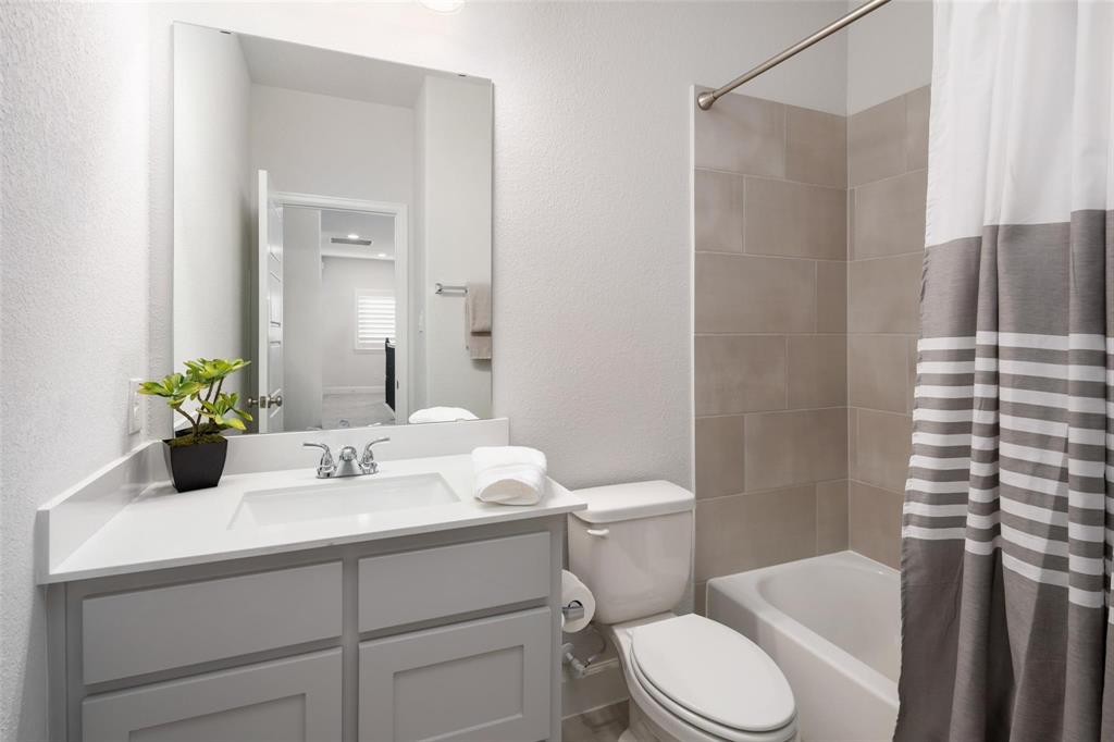 9600 Acorn Lane Little Elm, TX 75068 - Photo 21 of 34 a bathroom with a sink toilet and shower