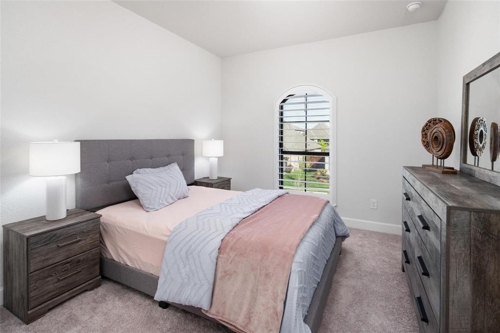 9600 Acorn Lane Little Elm, TX 75068 - Photo 22 of 34 a bedroom with a bed and a window