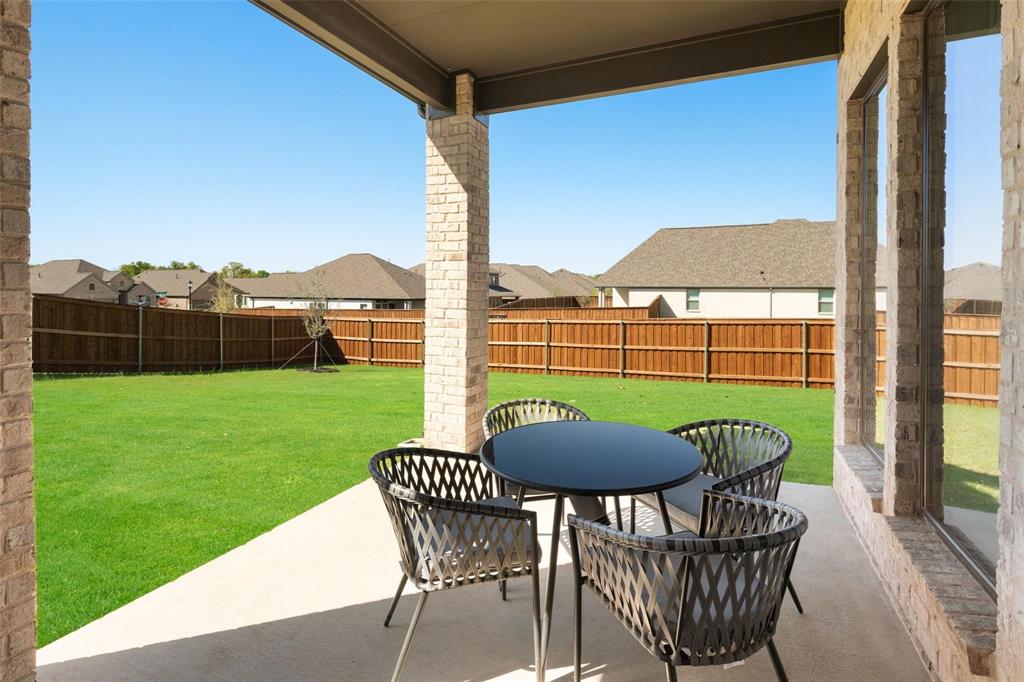9600 Acorn Lane Little Elm, TX 75068 - Photo 24 of 34 a view of a chair and table on the deck