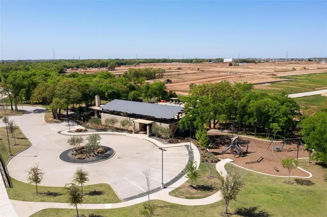 a view of a swimming pool with a table and chairs