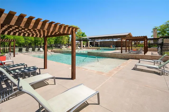 a view of a chairs and table in the patio