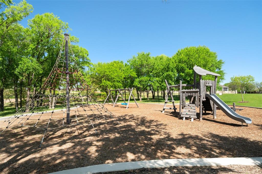 9600 Acorn Lane Little Elm, TX 75068 - Photo 33 of 34 a view of a park with swings and slides