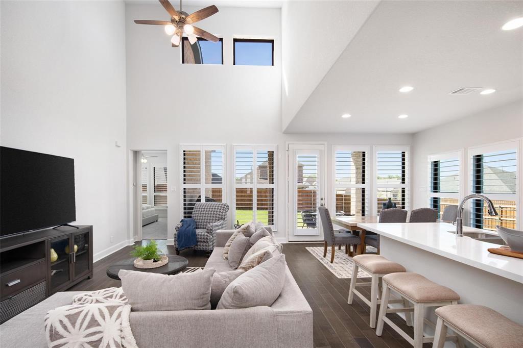 9600 Acorn Lane Little Elm, TX 75068 - Photo 4 of 34 a living room with furniture and a flat screen tv