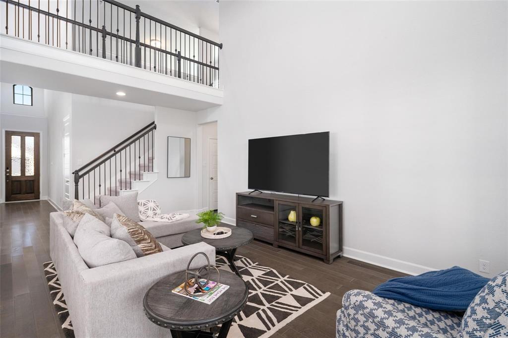 9600 Acorn Lane Little Elm, TX 75068 - Photo 5 of 34 a living room with furniture and a flat screen tv