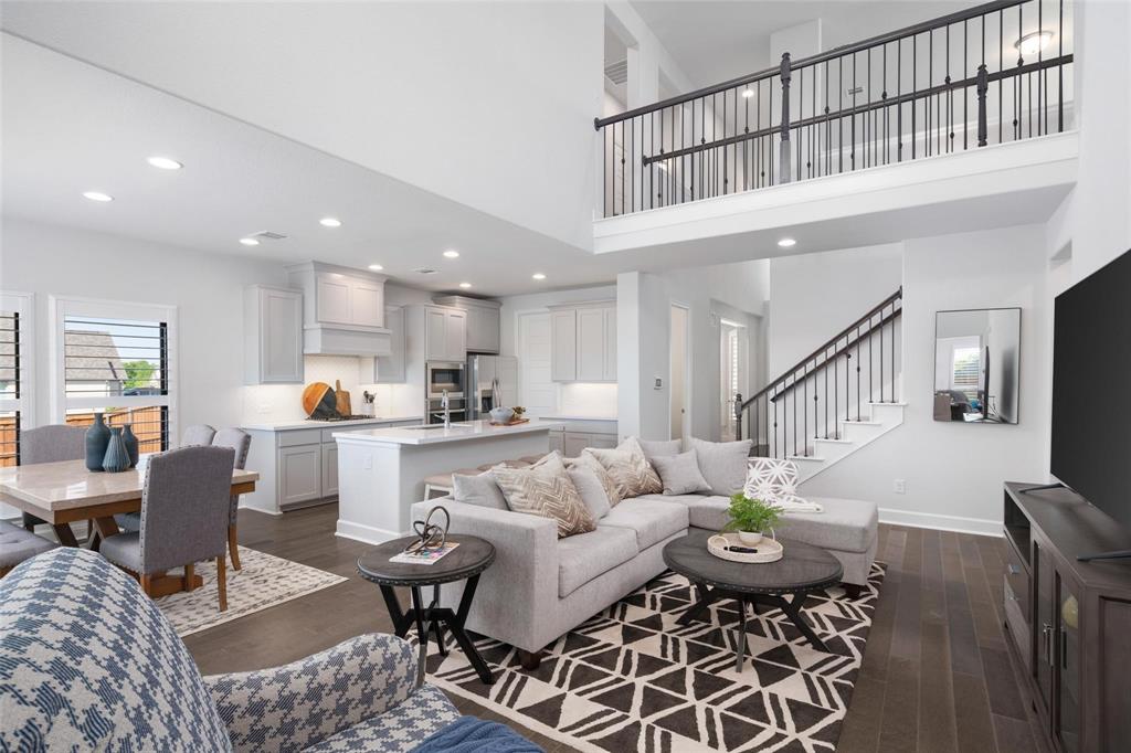 9600 Acorn Lane Little Elm, TX 75068 - Photo 6 of 34 a living room with furniture kitchen view and a dining table