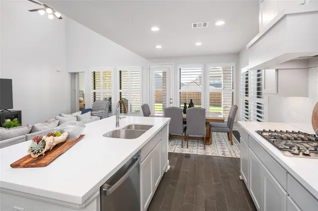 a kitchen with a sink and stove